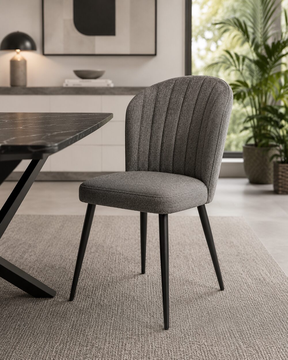 Upholstered dining chair beside a dark dining table