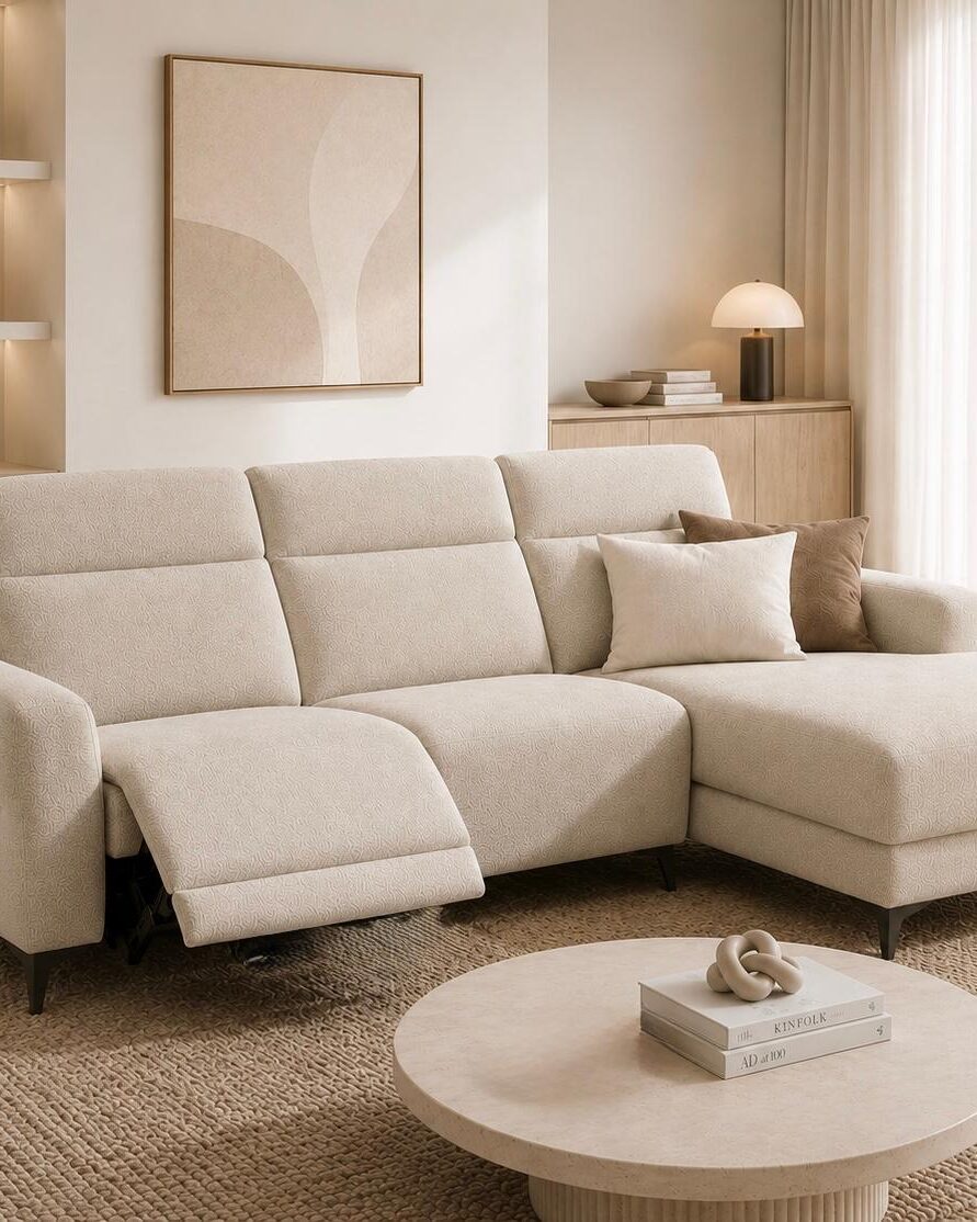 Cream fabric corner sofa with a round coffee table